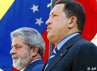 Brazil's President Luiz Inacio Lula da Silva, left, stands with his Venezuelan counterpart Hugo Chavez at Miraflores palace in Caracas,Venezuela, Friday, Feb. 27,2004. Silva is in Venezuela for the Group 15 Summit to be held today and Saturday. In the background is Venezuela's national flag. (AP Photo/Ricardo Stuckert, Agencia Brasil) **BRAZIL OUT**