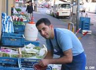 An ethnic Turk working at a fruit stand in Cologne