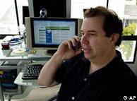 A man makes a phone call using VoIP technology