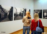 Two students visit an exhibition on the Auschwitz concentration camp in Berlin in 2004