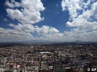 View over Mexico City, clear sky above, city below