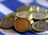 Coins above a Greek flag