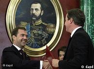 David Cameron shakes hands with Dmitry Medvedev