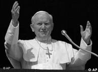 Pope John Paul II waves to the faithful from the window of his apartment overlooking St. Peter's Square at the Vatican in 1995