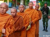 Buddhist monks morn attack victims in southern Thailand in June, 2011 