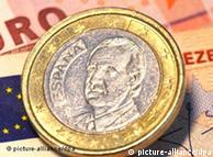 A euro coin on top of euro notes
