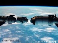 This TV grab taken on 2 November 2011 shows an animated video clip of the docking of the Tiangong-1 space lab module and the Shenzhou VIII (Shenzhou-8) spacecraft in space. China successfully carried out its first docking exercise on Thursday (3 November 2011) between two unmanned spacecraft, a key test of the rising powers plans to secure a long-term manned foothold in space. The Shenzhou-8 spacecraft joined the Tiangong (Heavenly Palace) 1 module about 340 km above Earth, in a maneuver carried live on state television. Photo: Imaginechina
