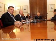 Giorgos Karatzaferis sits at table with other leaders