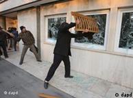 Iranian protesters smashing windows of the British embassy in Tehran