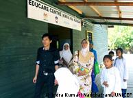 Teachers and students in front of the Kampung Numbak Education Center