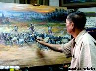 U Maung Maung Thein paints a landscape in his atelier