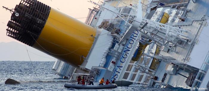 The luxury cruise ship Costa Concordia leans on its side after running aground the tiny Tuscan islan