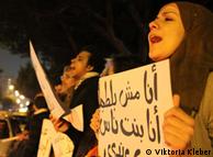 Protesters in Cairo holding signs for the military council to step down