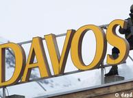 Sharpshooter on a roof next to a Davos sign