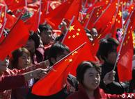 Chinese people wave national flags