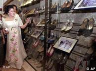 Imelda Marcos points looks at some of her 200 shoes on display at the Shoe Museum in Marikina City
