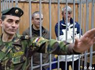Mikhail Khodorkovsky and Lebedev behind bars in the courtroom