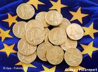 An EU symbol with euro coins over it