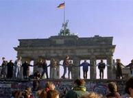Berliners sing and dance on top of The Berlin Wall