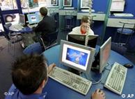 People surf 
the internet in an internet cafe in Frankfurt, central Germany