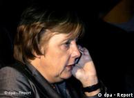 Merkel speaking on a mobile phone