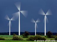 Image of four windmills at work in the landscape