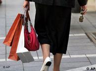 A woman walks with shopping bags in Frankfurt