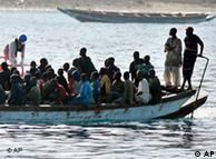 A  boat-load of would-be immigrants arrive at the port of Los Cristianos on the Spanish island of Tenerife