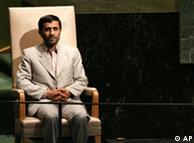 Mahmoud Ahmadinejad waiting for his speech in front of the UN assembly while sitting in a chair