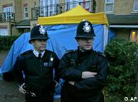 British police officers stand guard beside a forensic tent erected outside the north London home of Alexander Litvinenko