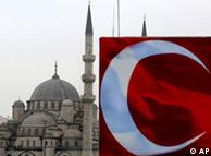 The white crescent of the Turkish flag is seen in front of the New Mosque in Istanbul, Turkey