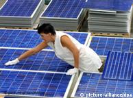 woman polishing solar modules