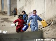 Children running to get water in Kabul