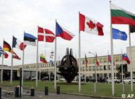 National flags are seen outside NATO headquarters in Brussels