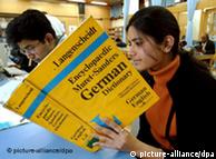 A student in India looks-up a word in the German dictionary