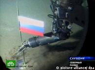 A Russian flag gets planted by a robot on the sea floor