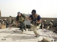 Plainclothes contractors working for Blackwater USA take part in a firefight in Iraq
