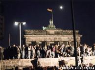 Germans standing on the Berlin Wall, November 9, 1989