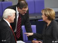 Merkel talking to Steinmeier and Franz Josef Jung in the Bundestag