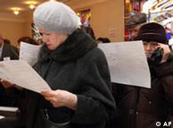 Russian citizens queue to cast their ballots at a polling station in the Russian embassy in Vilnius, Lithuania, Sunday, Dec. 2, 2007