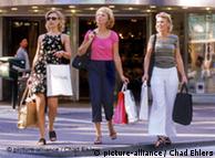 Three women with shopping bags