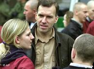 The German Neo-Nazi leader Steffen Hupka, center, talks to unidentified participants of a Neo-Nazi rally in the city of Leipzig, eastern Germany, Saturday, Nov. 3, 2001. 
