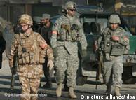 US and British soldiers secure the site of a suicide attack in Kabul