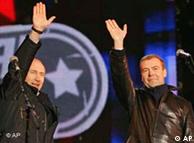 Medvedev and Putin waving to their supporters