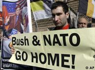 Protestor in Moscow with sign opposing NATO