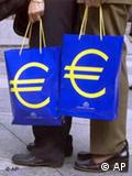 The euro symbol on two blue shopping bags