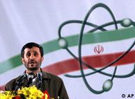 Iranian President Mahmoud Ahmadinejad next to an atomic flag