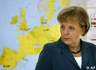 Germany's Chancellor Angela Merkel stands in front of an European map 