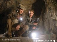 Harrison Ford playing Indiana Jones looking at a white light in front of him