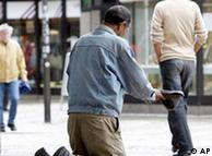 A man begs for money on a Gelsenkirchen street